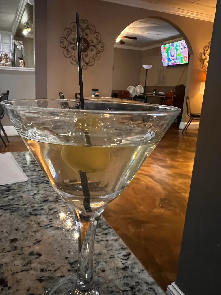 Dirty Martini - A classic cocktail — premium vodka with olive brine and a garnish of green olives