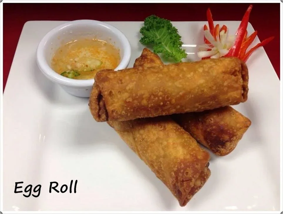 Egg Rolls - Classic crispy egg rolls filled with vegetables and served with sweet chili sauce