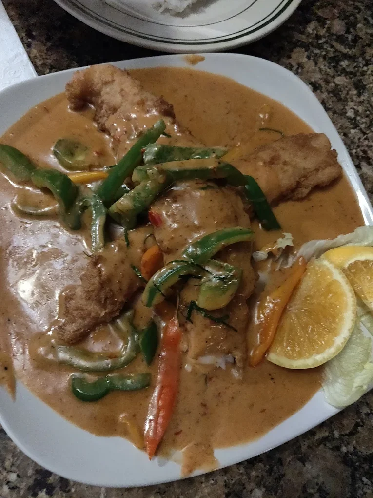 Panang Curry with Catfish - Creamy Panang curry with tender catfish and kaffir lime leaves
