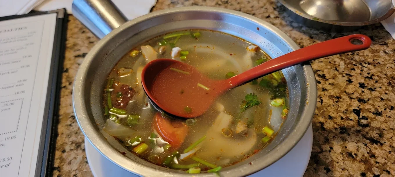 Tom Kha Soup - Aromatic coconut milk soup with galangal, lemongrass, mushrooms, and lime
